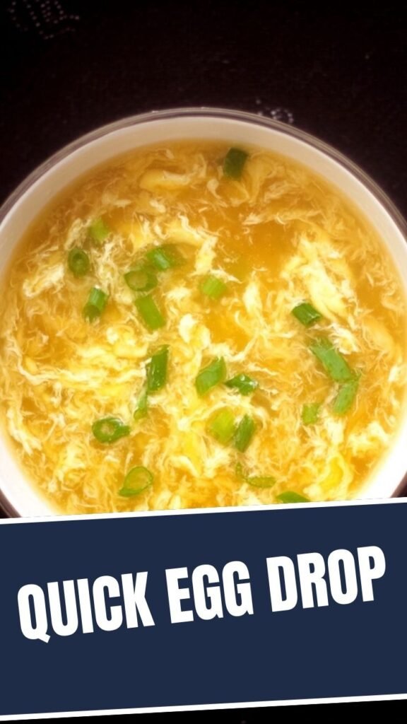 A steaming bowl of classic egg drop soup with visible egg ribbons.