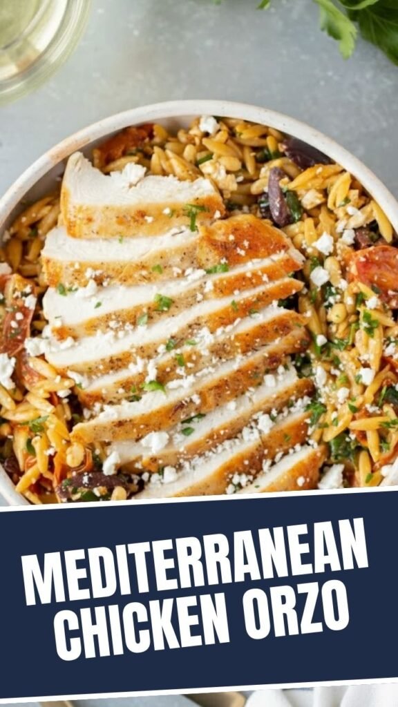 A colorful bowl of Mediterranean chicken orzo with fresh herbs and vegetables.