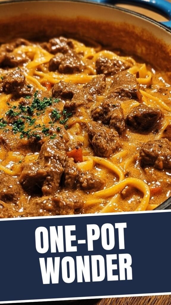 A rich one-pot creamy beef dish in a pan, ready to serve.