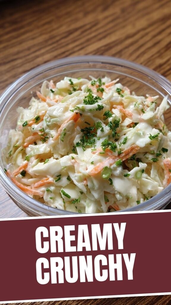 A bowl of fresh creamy coleslaw with shredded cabbage and carrots