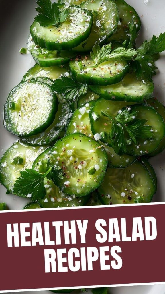 A vibrant green cucumber salad with fresh dill and onions in a bowl