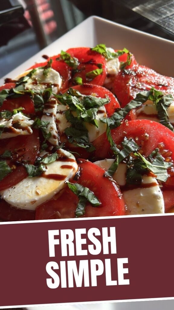 A vibrant Caprese salad featuring fresh mozzarella, ripe tomatoes, and basil leaves