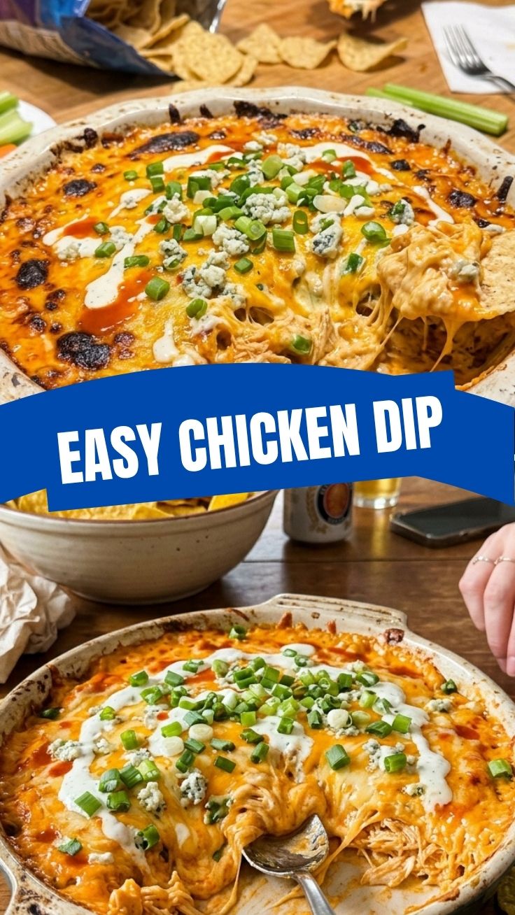 A hot and bubbly Buffalo chicken dip in a baking dish, garnished with green onions