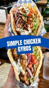 A close-up shot of a freshly prepared chicken gyros with tzatziki sauce and vegetables.