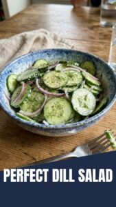 A refreshing bowl of cucumber dill salad with thinly sliced cucumbers and fresh dill.