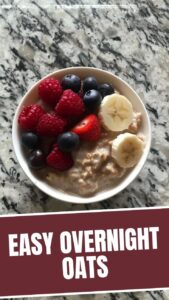 A glass jar filled with delicious overnight oats, topped with fresh berries
