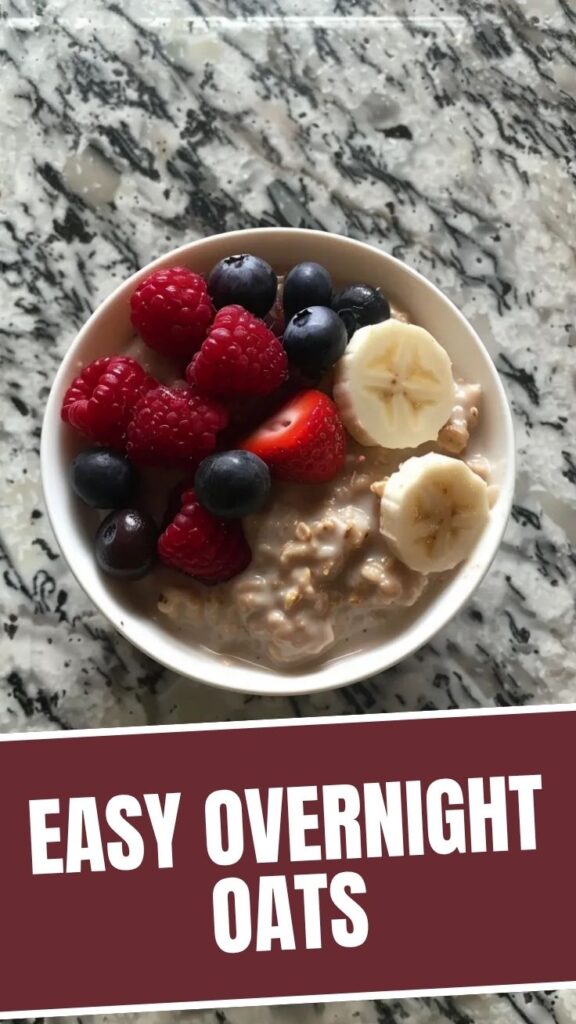 A glass jar filled with delicious overnight oats, topped with fresh berries