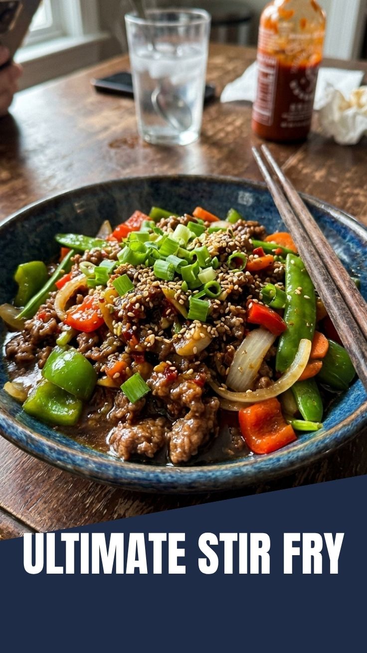 A vibrant ground beef stir fry dish in a wok with colorful vegetables.