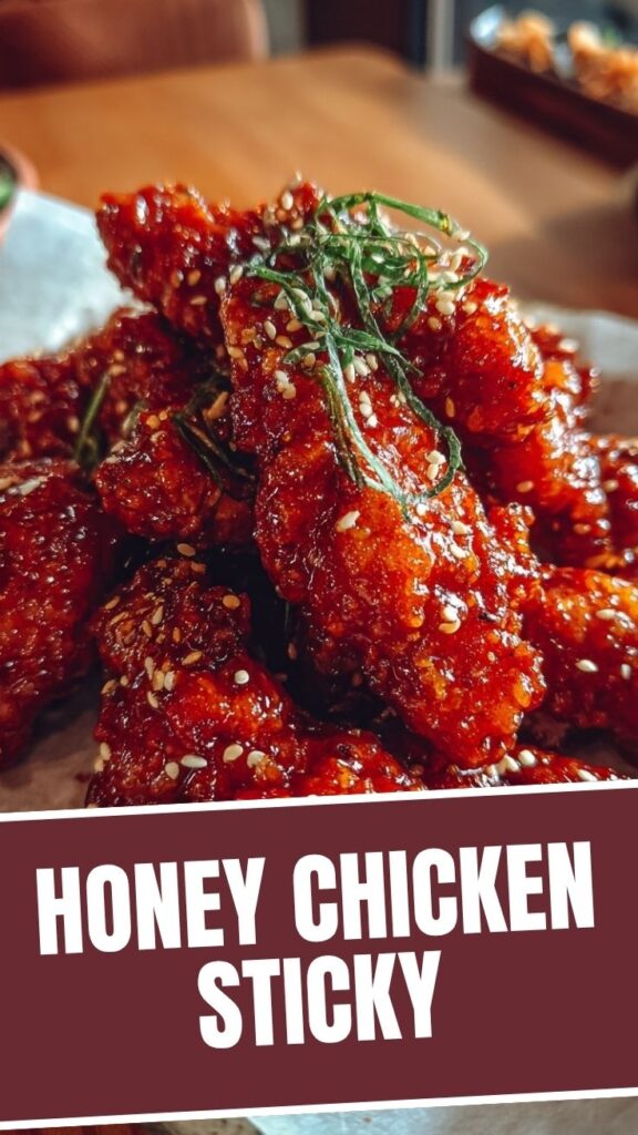 A plate of crispy hot honey chicken, glazed and ready to eat