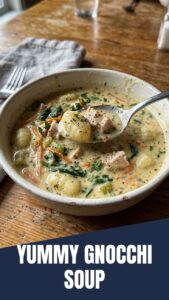 A bowl of Olive Garden style chicken gnocchi soup with a creamy broth and savory ingredients.