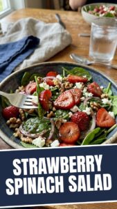 A refreshing strawberry spinach salad with nuts and dressing