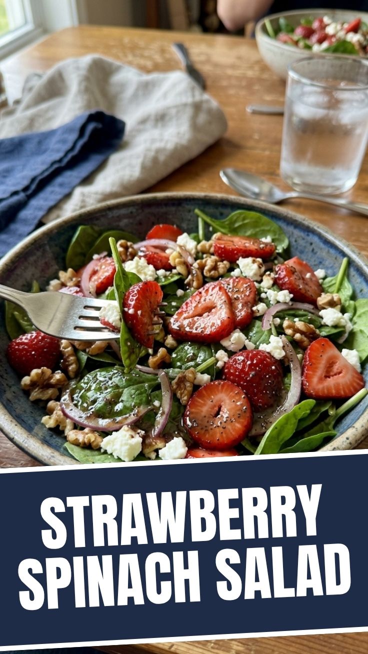 A refreshing strawberry spinach salad with nuts and dressing