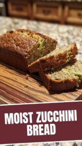 A freshly baked loaf of zucchini bread cooling on a wire rack.