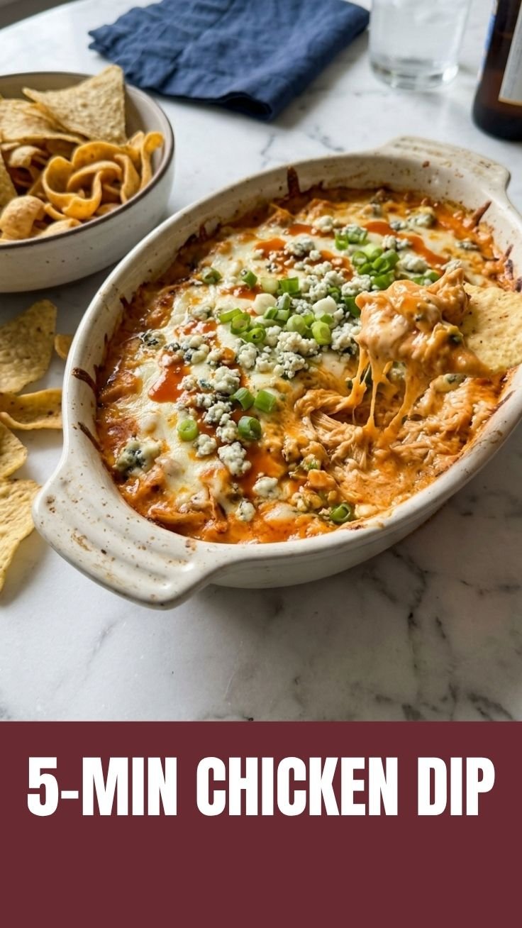 Buffalo Chicken Dip in a baking dish with golden bubbly cheese