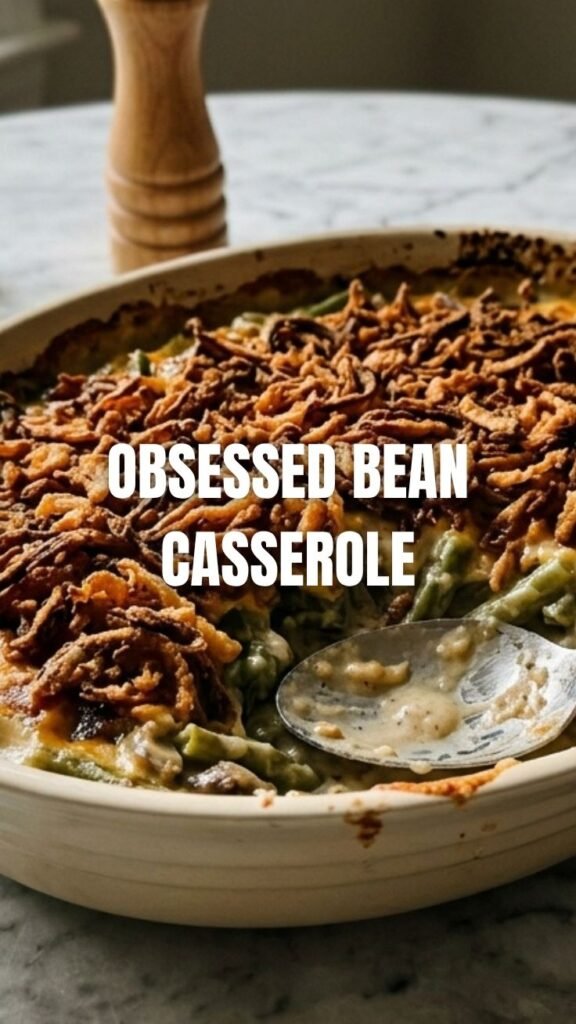 A baked green bean casserole with crispy fried onions on top, ready to serve.