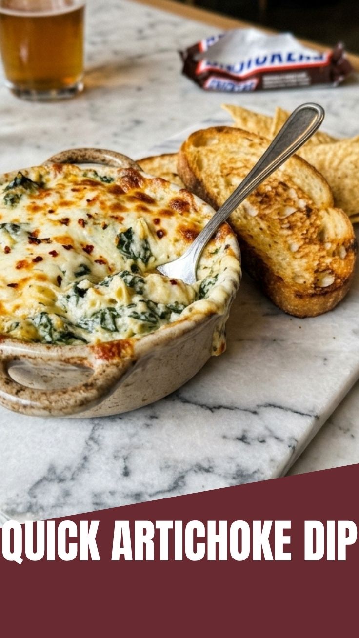 A bubbling hot spinach artichoke dip in a rustic bowl.