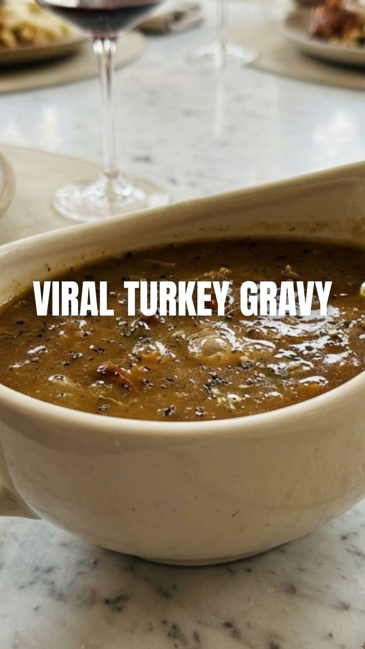 Rich turkey gravy being whisked in a saucepan