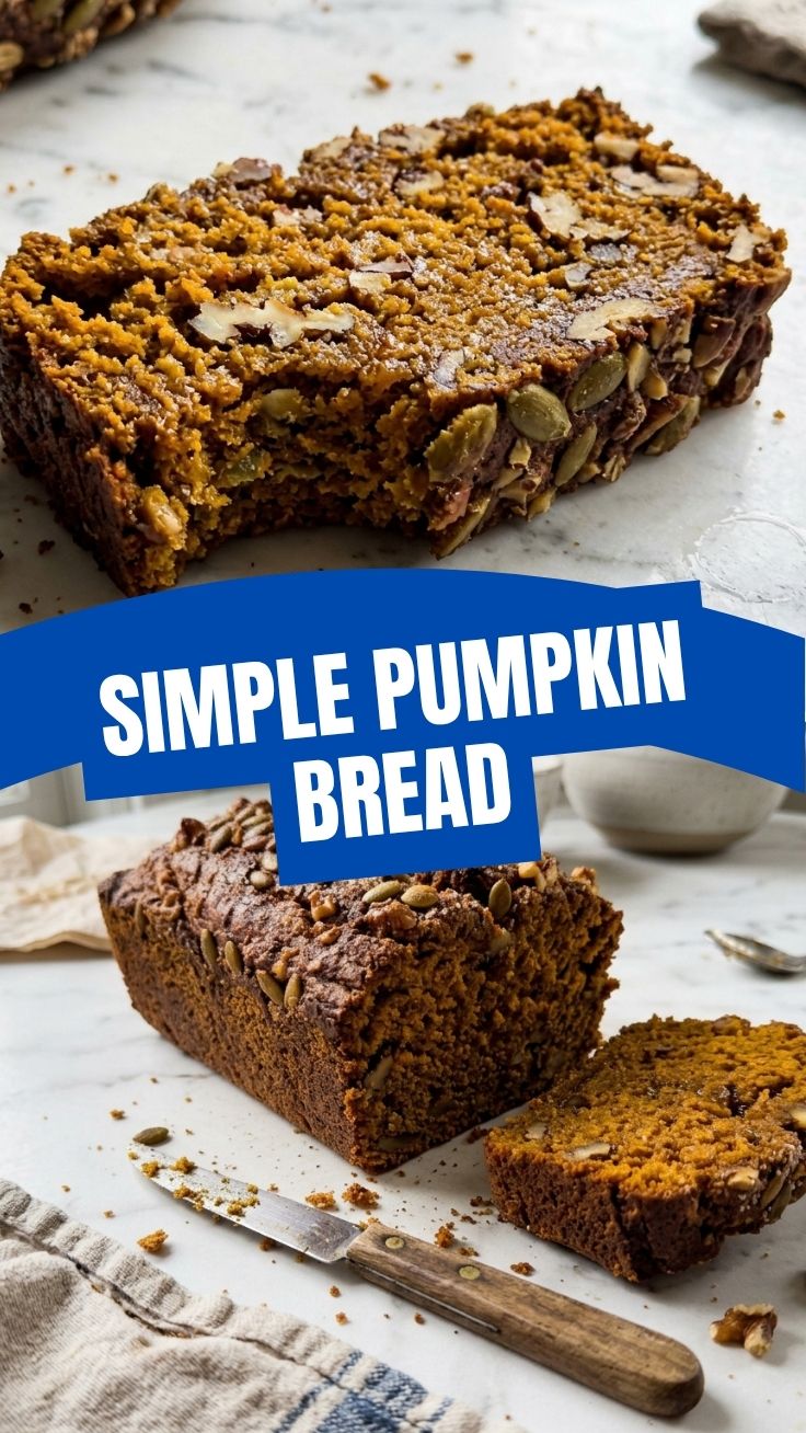 A freshly baked loaf of pumpkin bread, rich and golden brown on a cooling rack.