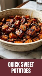 Close-up of maple roasted sweet potatoes, glistening and caramelized.