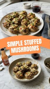 A platter of golden-baked stuffed mushrooms, filled with a savory mixture.